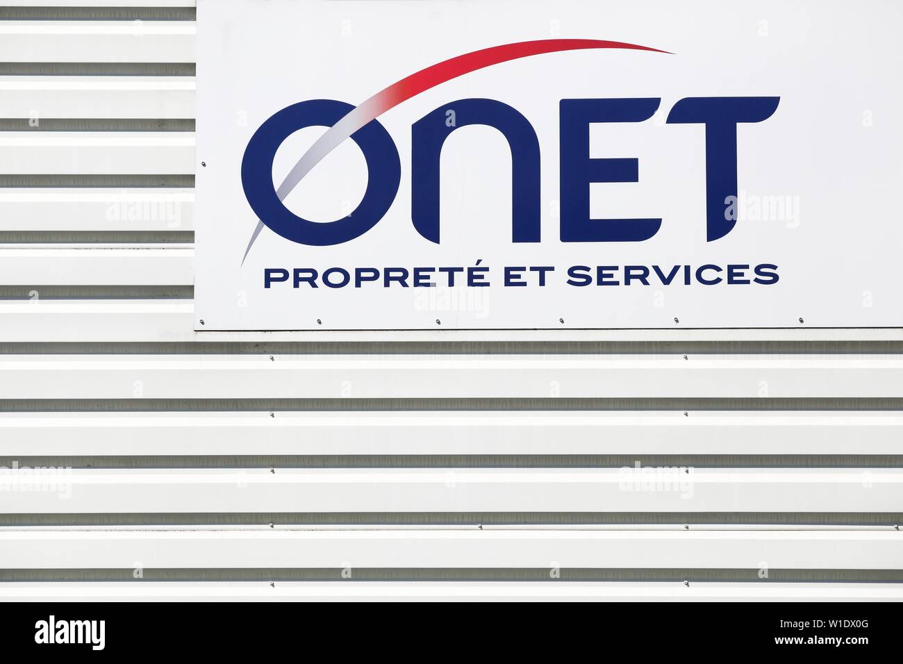 Saint Egreve, France - June 19, 2019: ONET logo on a building. ONET is today the French leader in business services in the areas of cleanliness Stock Photo