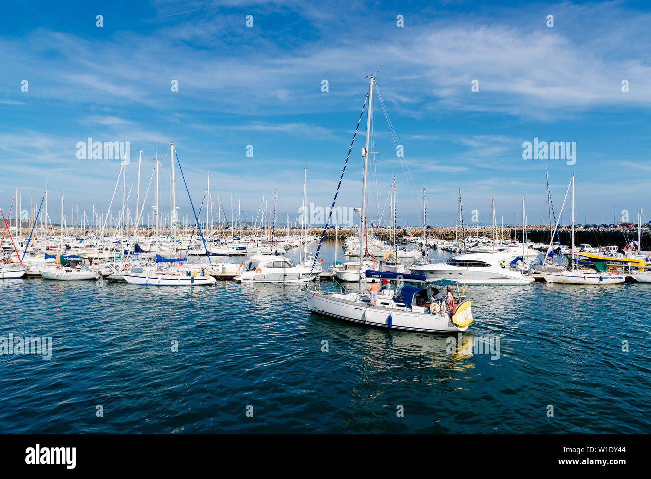 Morgat, France - August 4, 2018:  The marina of Morgat a sunny day of summer with many smalls boats aligned in the piers Stock Photo