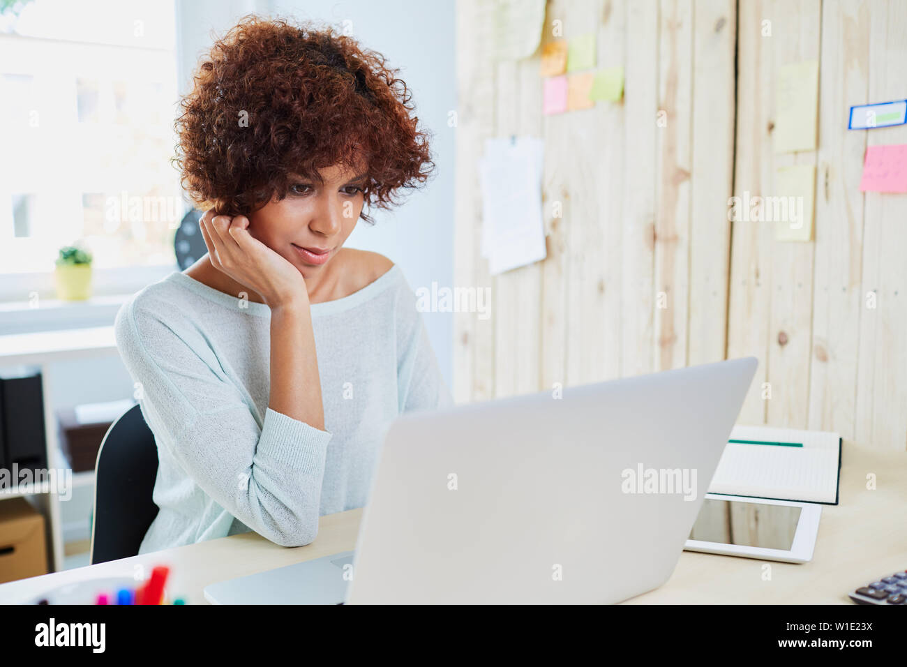 Woman working on laptop Stock Photo