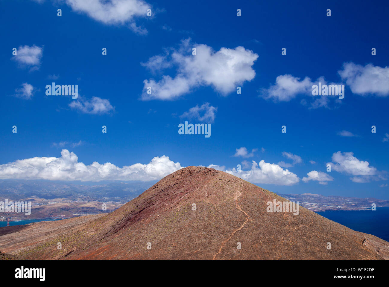 Gran Canaria, Canary Islands, image taken  from La Isleta peninsula, Montana las Coloradas in the foreground, natural background of predominantly sky Stock Photo