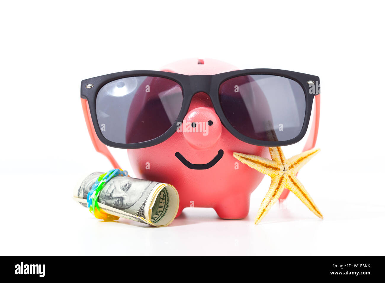 Pink piggy bank with glasses isolated on a white Stock Photo - Alamy