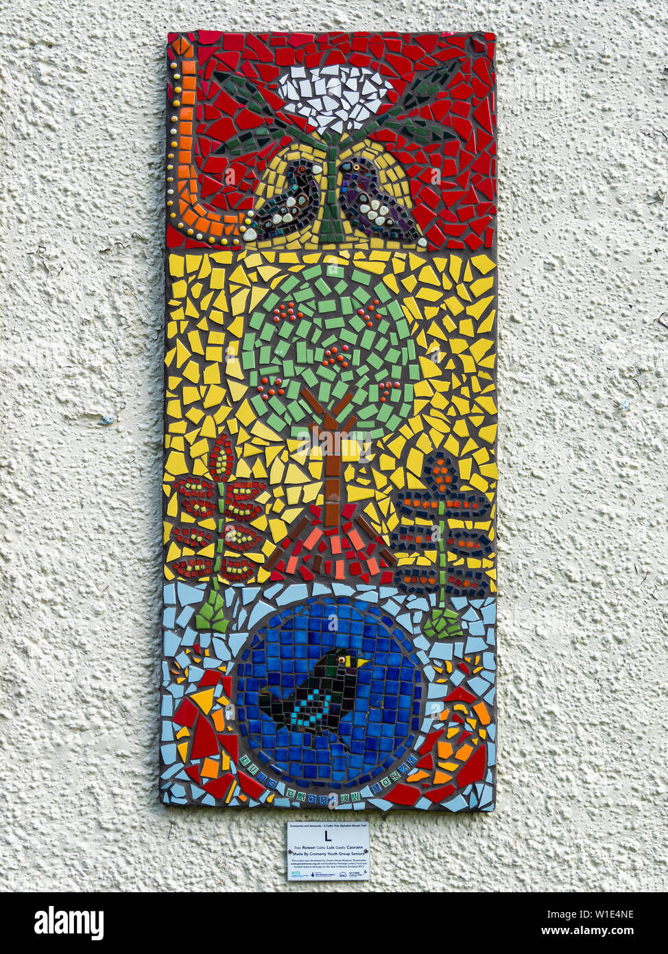 Mosaic depicting a Rowan (Luis in Celtic) tree on the side of a bus shelter in Cromarty, Black Isle, Scotland. Stock Photo