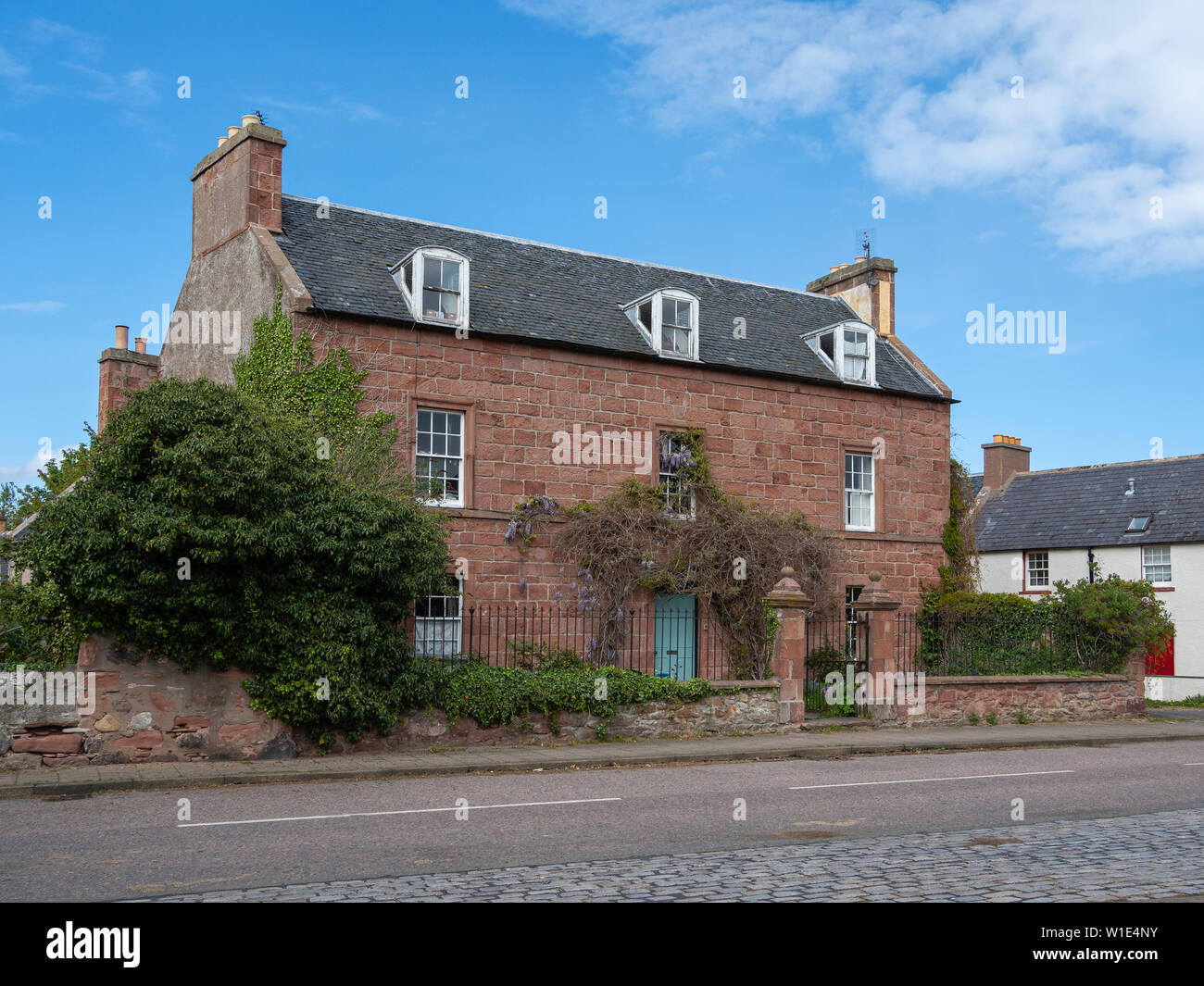 Traditional house with wisteria in Cromarty on the Black Isle, Highland, Scotland Stock Photo