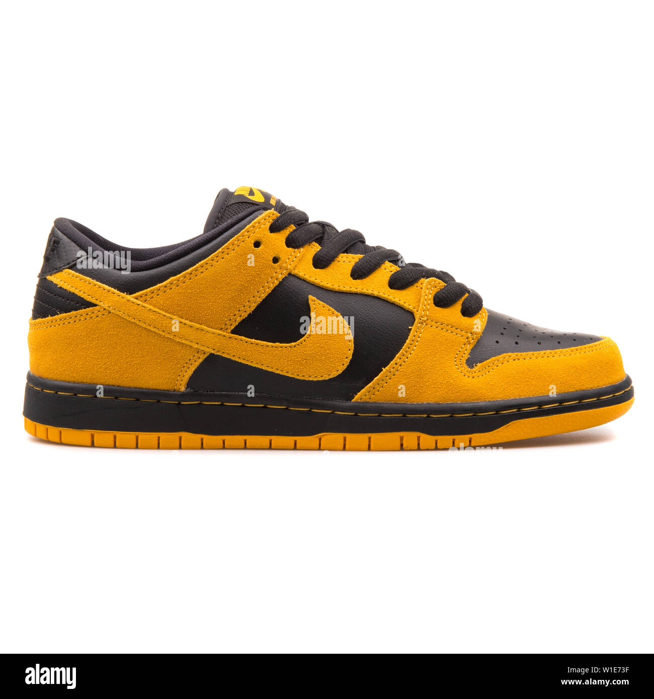 VIENNA, AUSTRIA - AUGUST 25, 2017: Nike Dunk Low Pro SB gold and black  sneaker on white background Stock Photo - Alamy