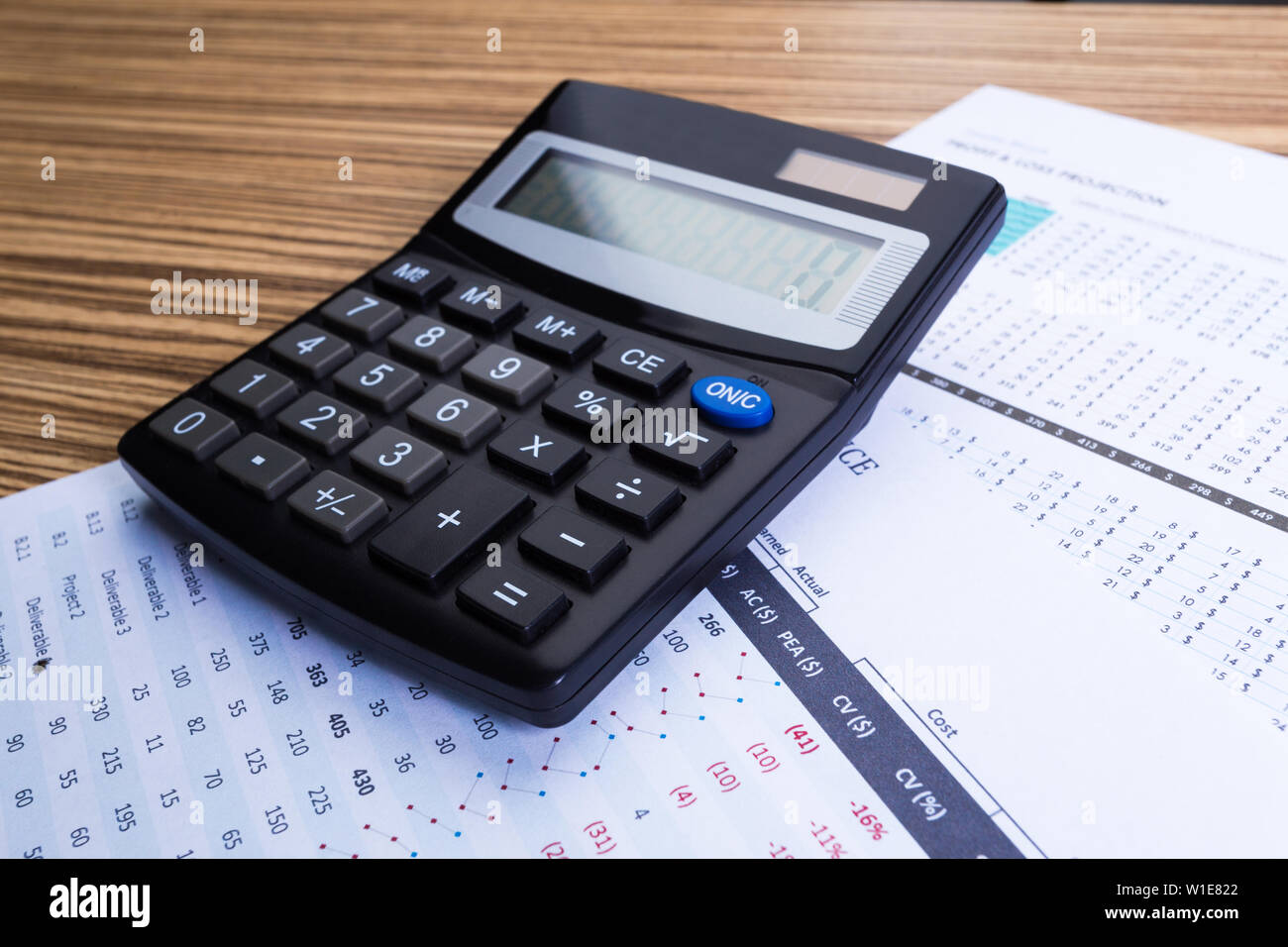 Graphs and Calculator Stock Photo - Alamy