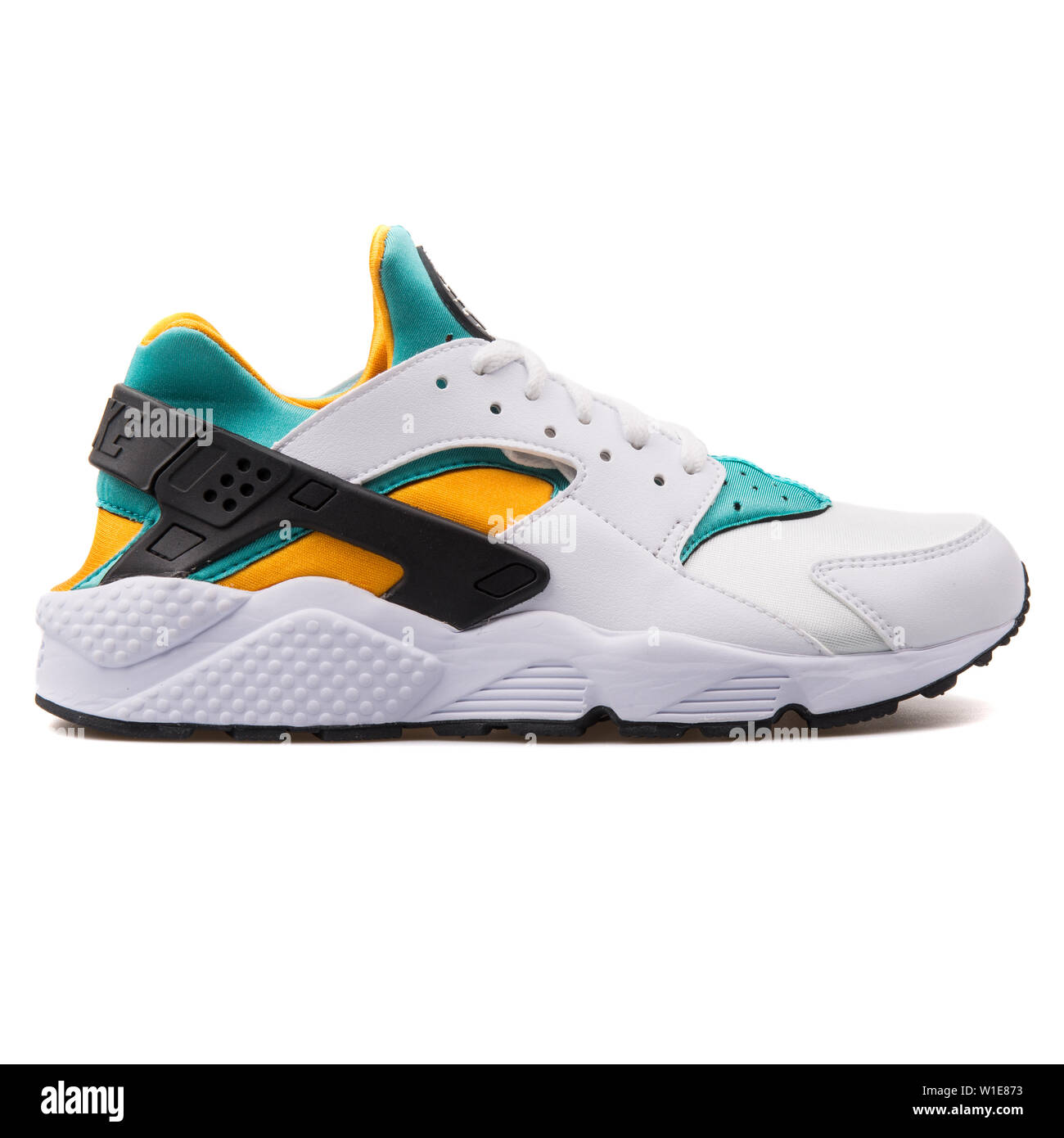 green and yellow nike huarache