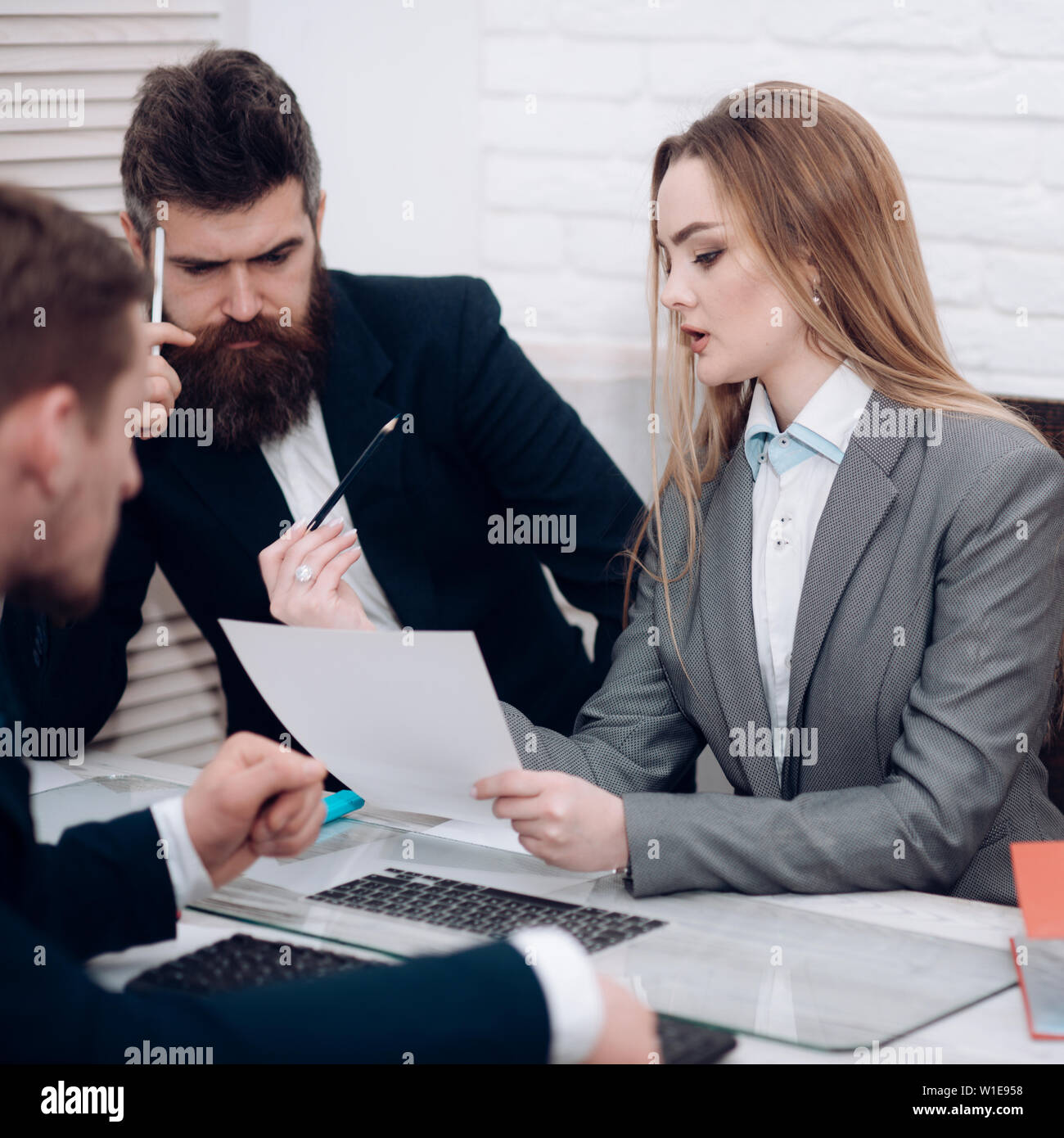 Lady manager tries to organize working process with colleagues in ...