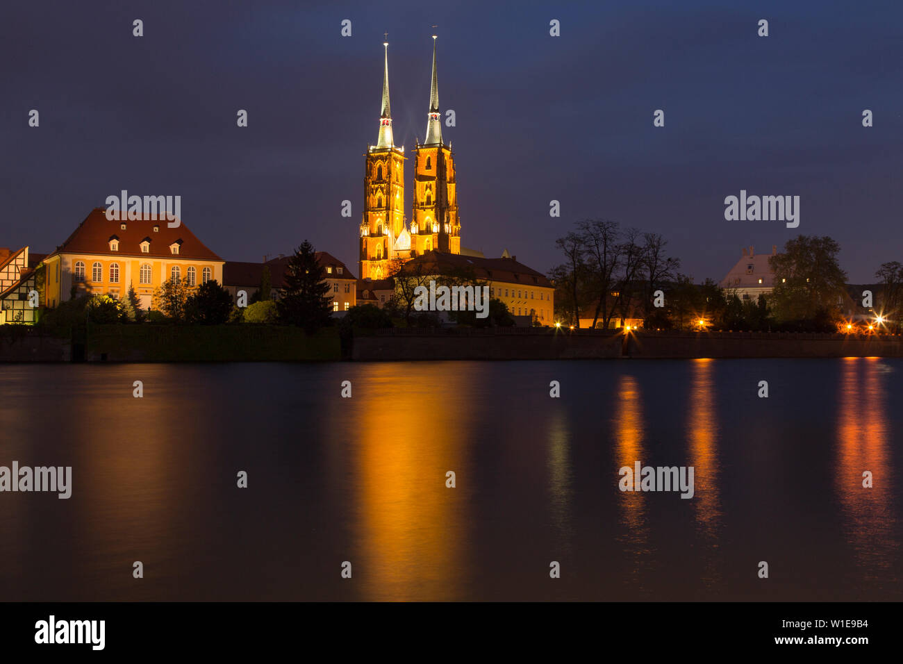Night photography: reflections of the illuminated cathedral in the river Odra, Wroclaw, Poland. Stock Photo