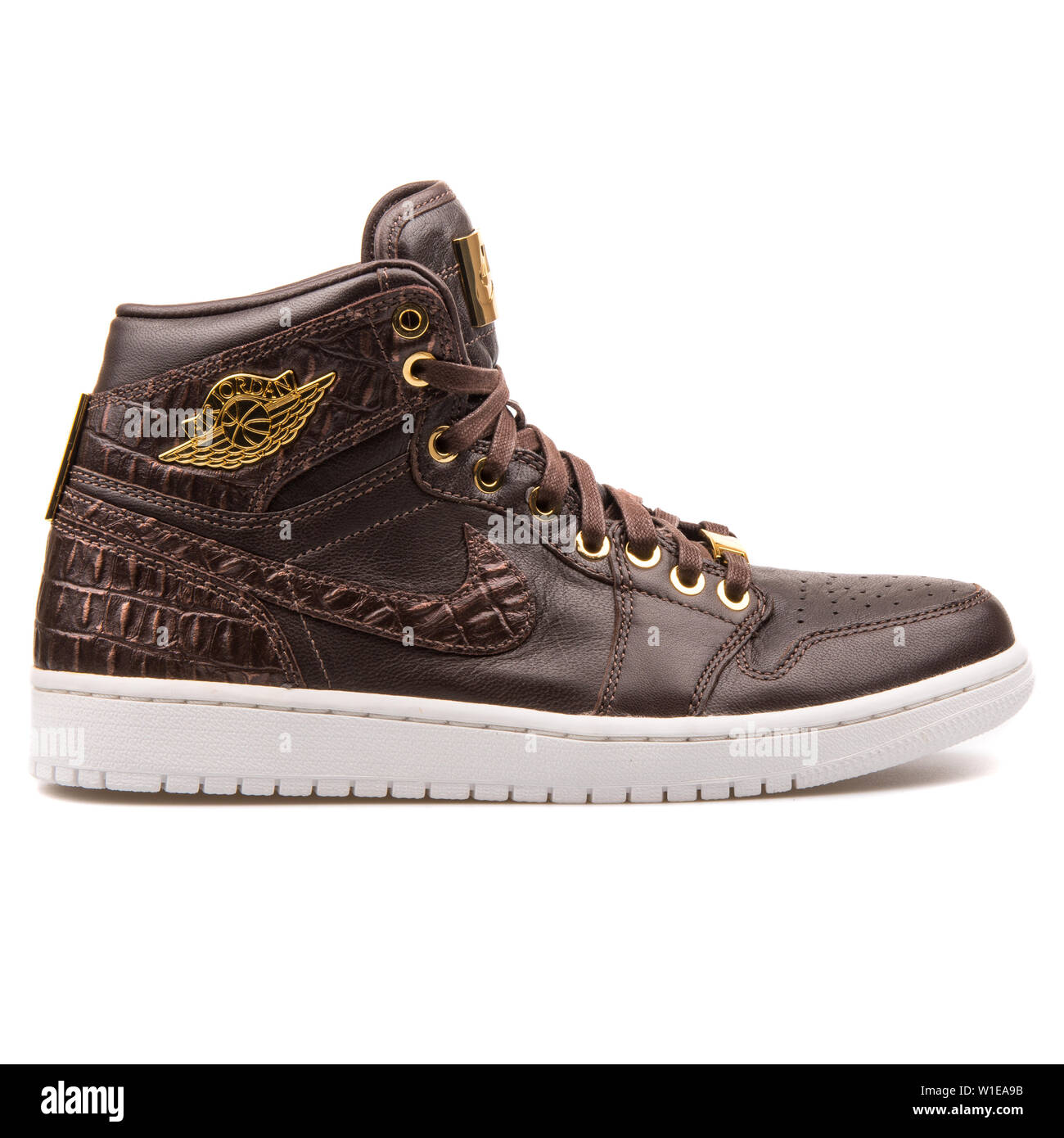 VIENNA, AUSTRIA - JUNE 14, 2017: Nike Air Jordan 1 Pinnacle brown and gold  sneaker isolated on white background Stock Photo - Alamy