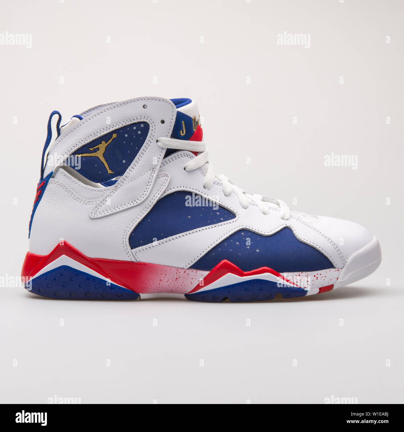 VIENNA, AUSTRIA - JUNE 14, 2017: Nike Air Jordan 7 Retro white, blue and  red sneaker isolated on grey background Stock Photo - Alamy
