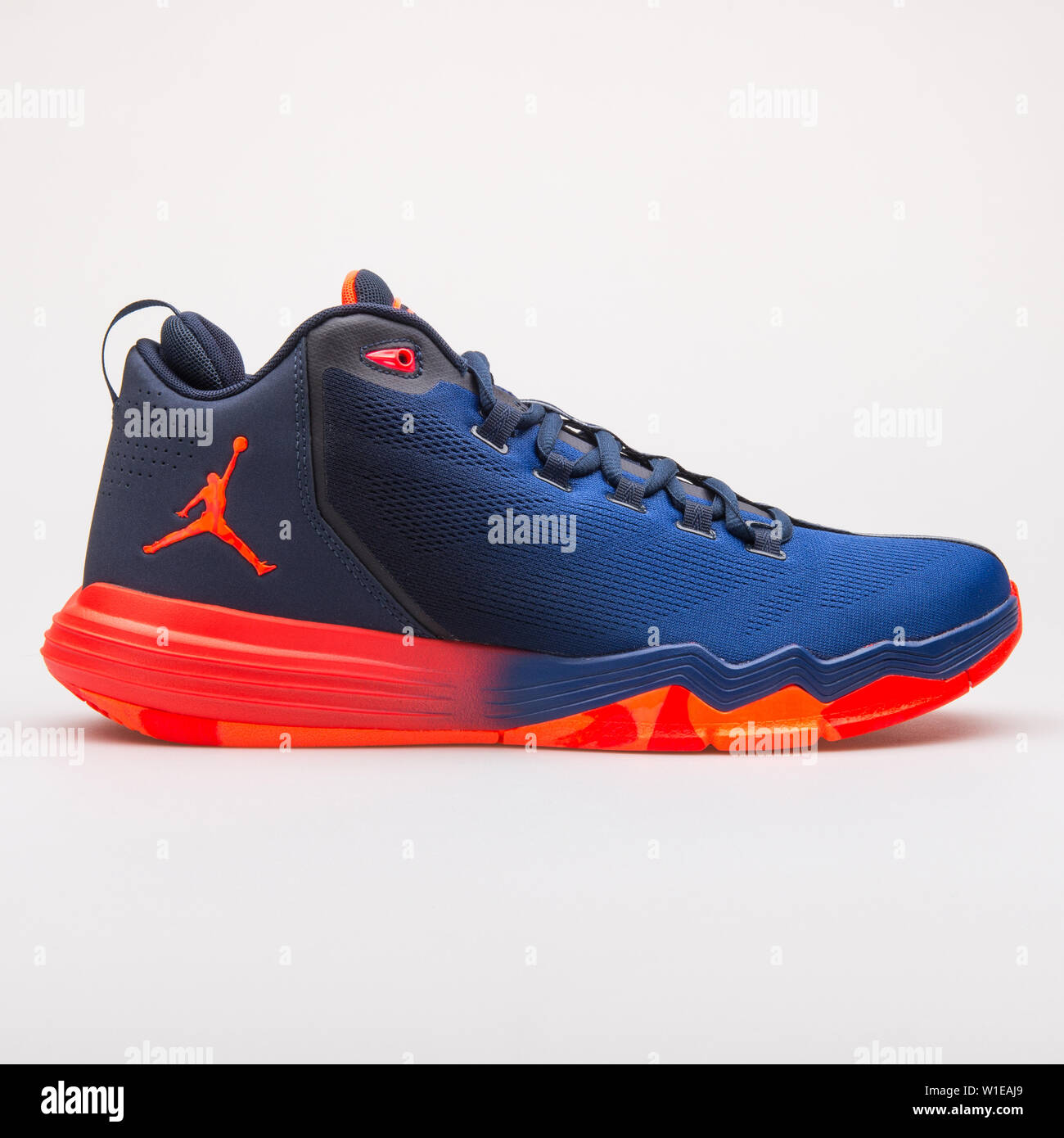 VIENNA, AUSTRIA - JUNE 14, 2017: Nike Jordan CP3 IX AE infrared and blue sneaker isolated on grey background Stock Photo