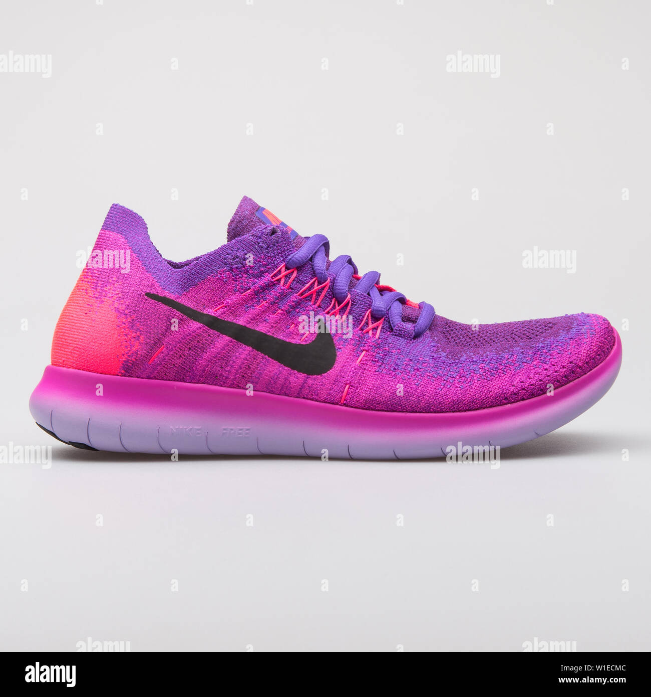 VIENNA, AUSTRIA - AUGUST 7, 2017: Nike Free RN Flyknit 2017 pink and purple  sneaker on white background Stock Photo - Alamy