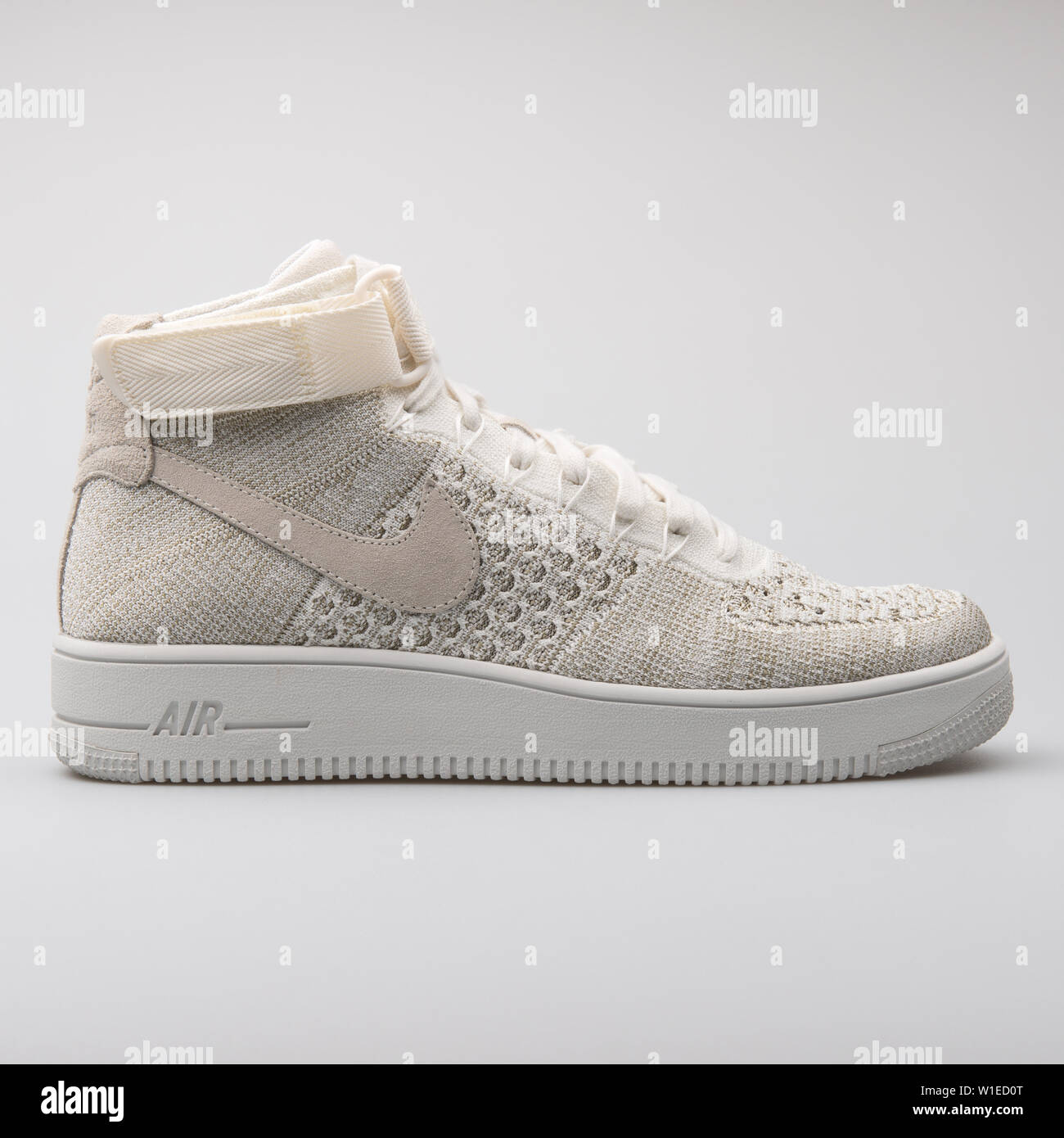 VIENNA, AUSTRIA - AUGUST 7, 2017: Nike Air Force 1 Ultra Flyknit Mid beige  and white sneaker on white background Stock Photo - Alamy
