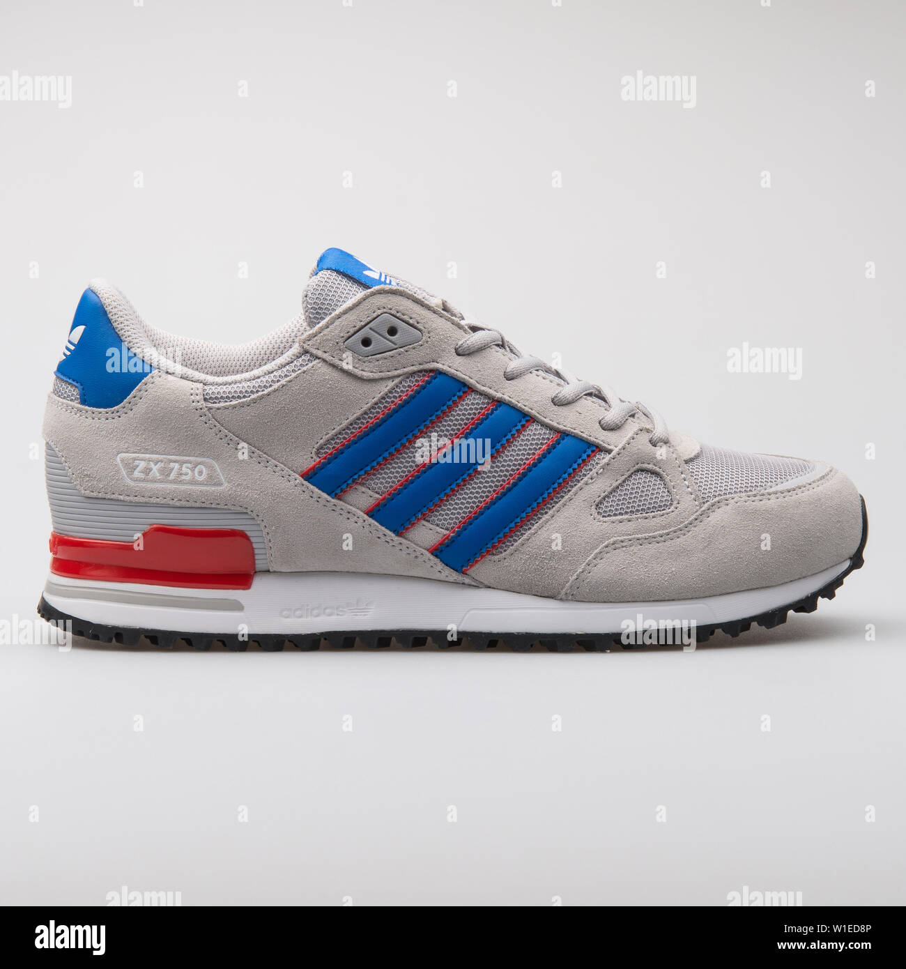 VIENNA, AUSTRIA - AUGUST 7, 2017: Adidas ZX750 grey, blue and red sneaker  on white background Stock Photo - Alamy