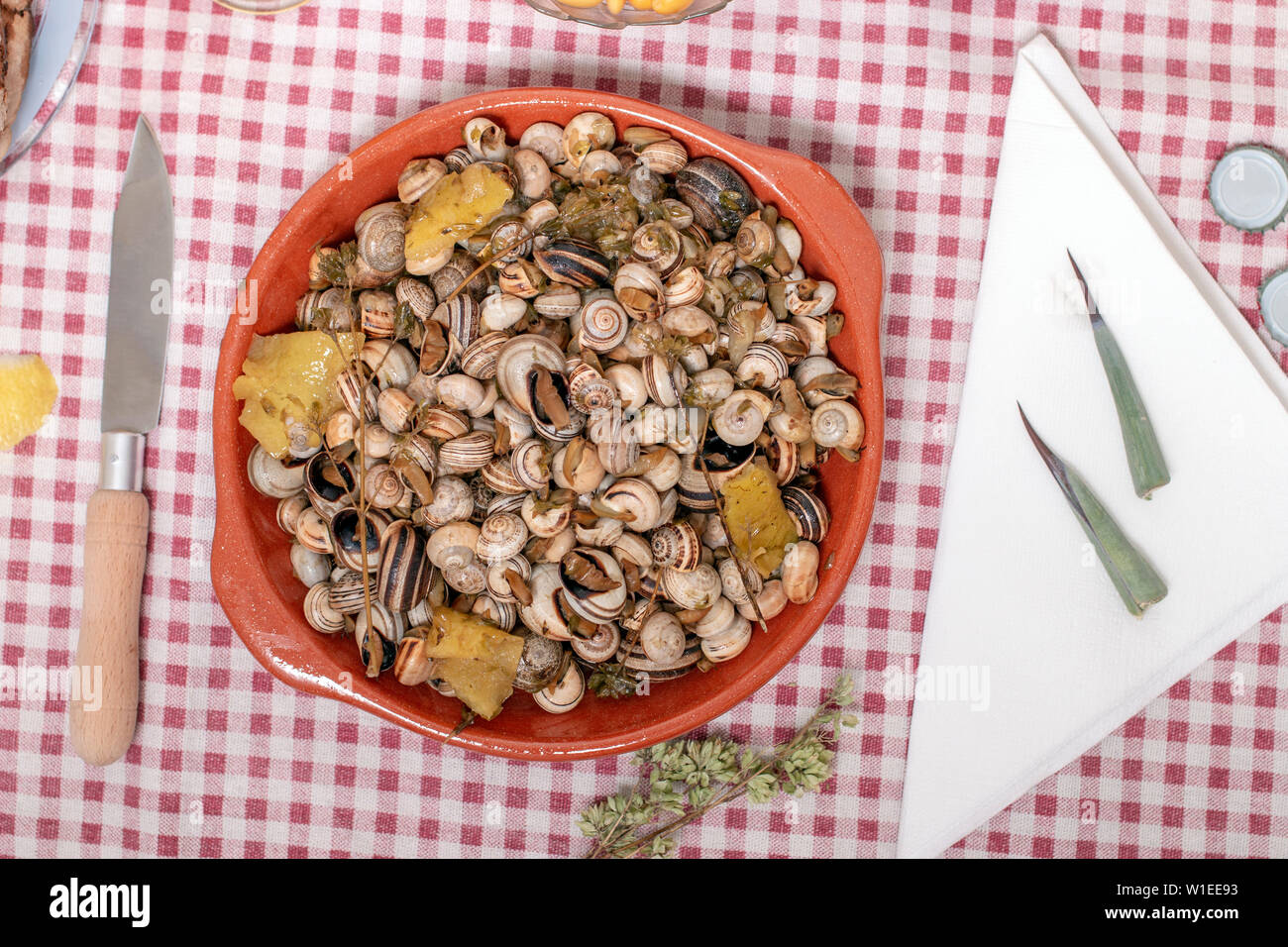 Snail Toast Traditional Portuguese dish of cooked snails and toasted bread and beer ...