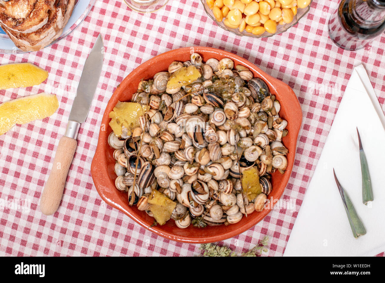 Traditional Portuguese dish of cooked snails and toasted bread and beer