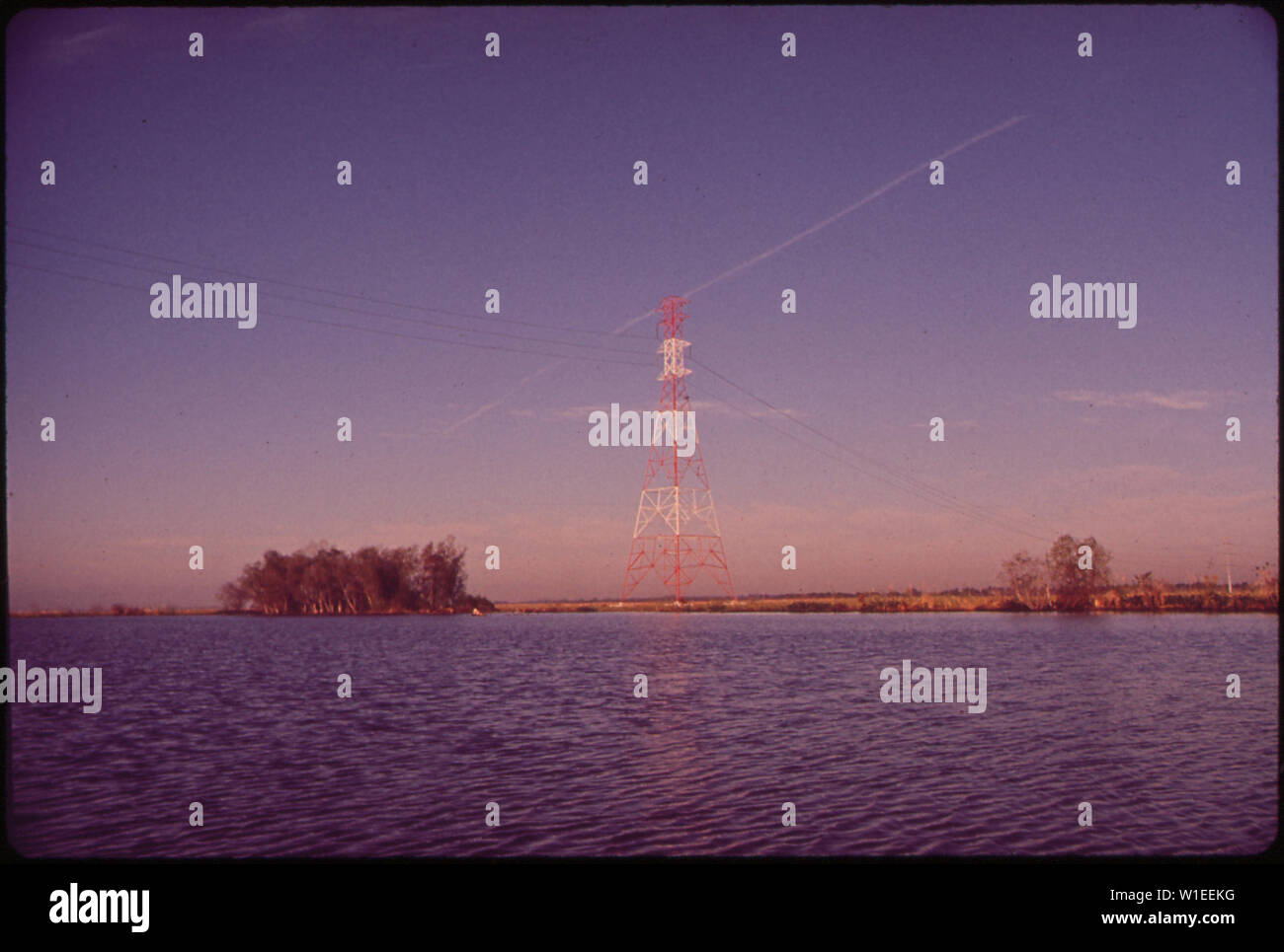 HIGH VOLTAGE UTILITY LINE CROSSES THE BAYOU WATERWAY APPROXIMATELY 10 MILES SOUTH OF