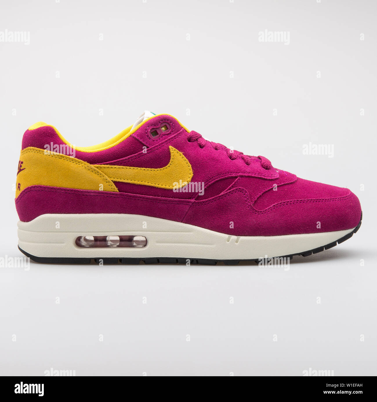 Cuna Cromático retroceder VIENNA, AUSTRIA - AUGUST 7, 2017: Nike Air Max 1 Premium purple and yellow  sneaker on white background Stock Photo - Alamy