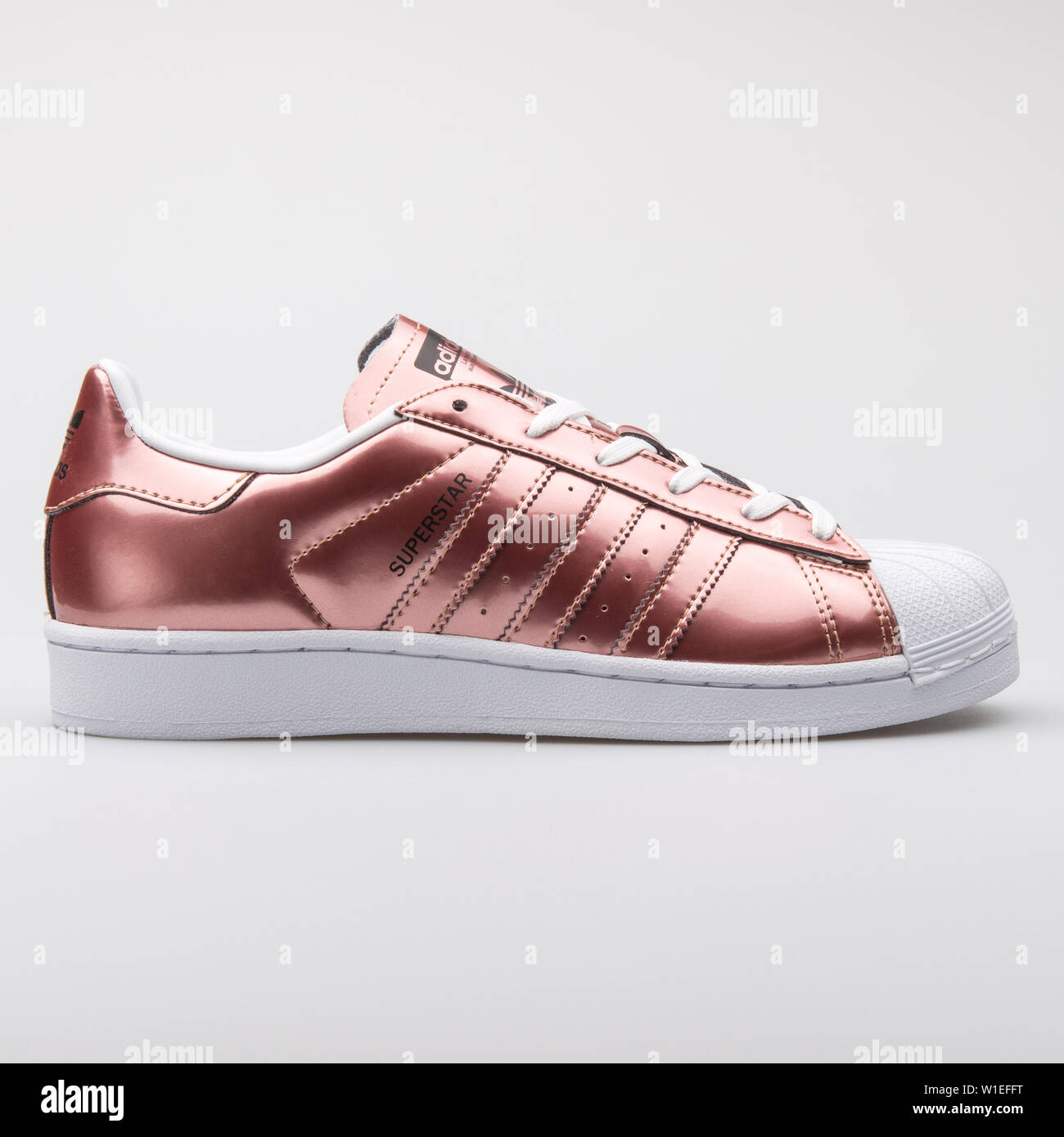 VIENNA, AUSTRIA - AUGUST 7, 2017: Adidas Superstar copper metallic sneaker  on white background Stock Photo - Alamy