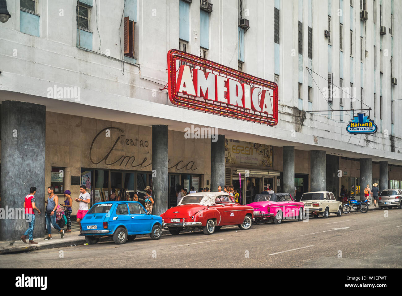 Old vintage cars parked outside Teatro America, La Habana (Havana), Cuba, West Indies, Caribbean, Central America Stock Photo