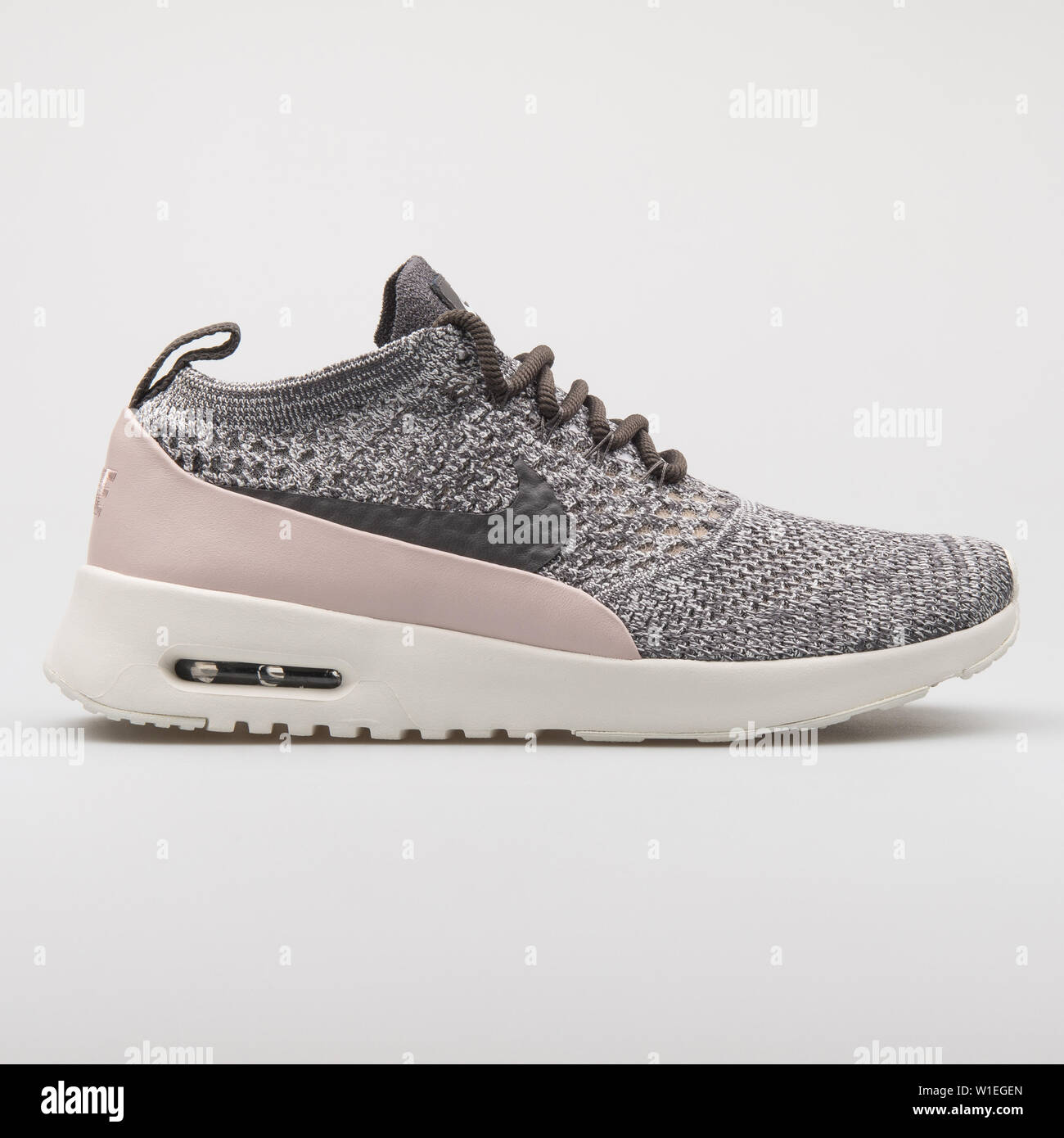 VIENNA, AUSTRIA - AUGUST 7, 2017: Nike Air Max Thea Ultra Flyknit grey and  pink sneaker on white background Stock Photo - Alamy