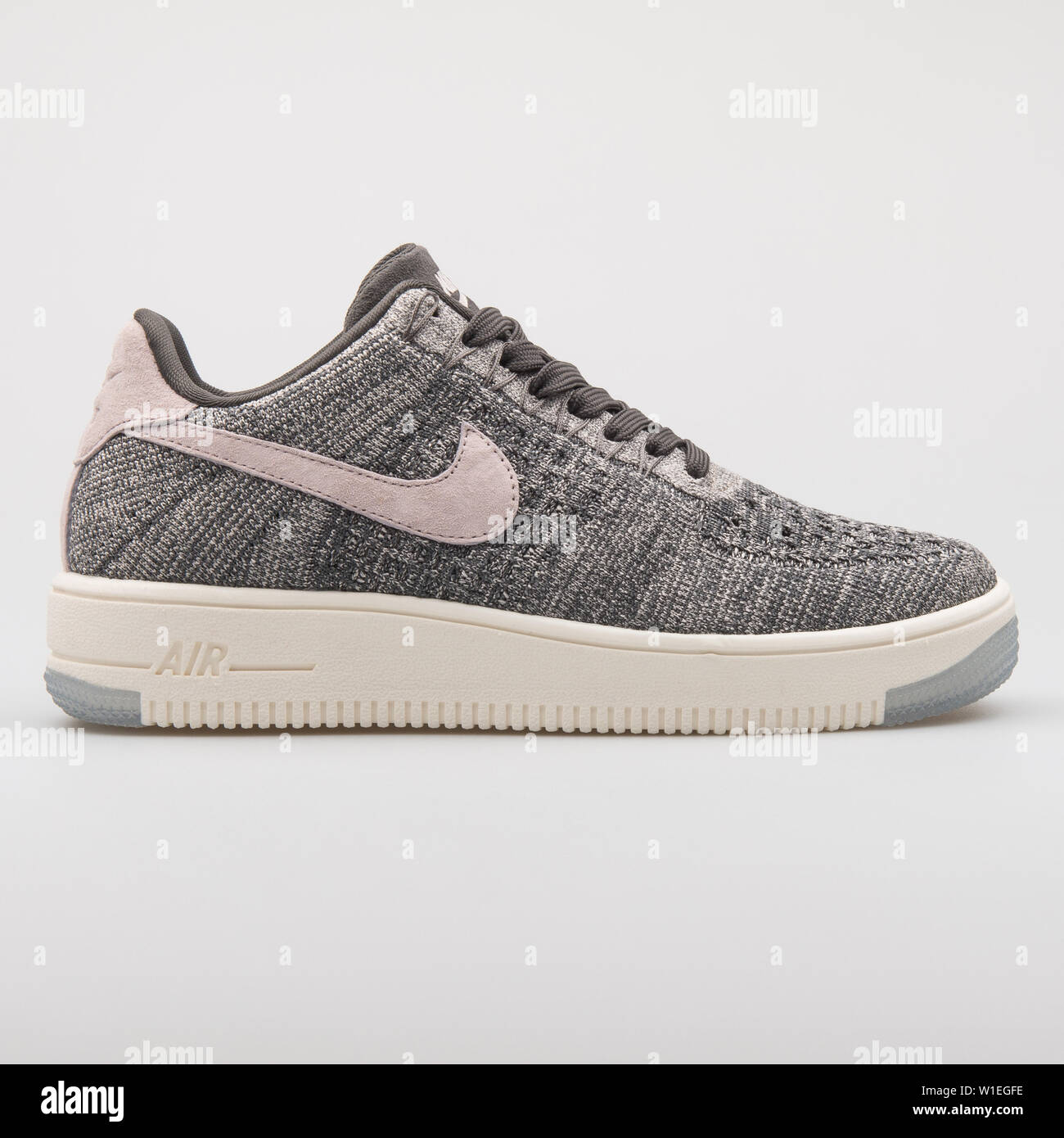 VIENNA, AUSTRIA - AUGUST 7, 2017: Nike Air Force 1 Ultra Flyknit Low grey  and pink sneaker on white background Stock Photo - Alamy