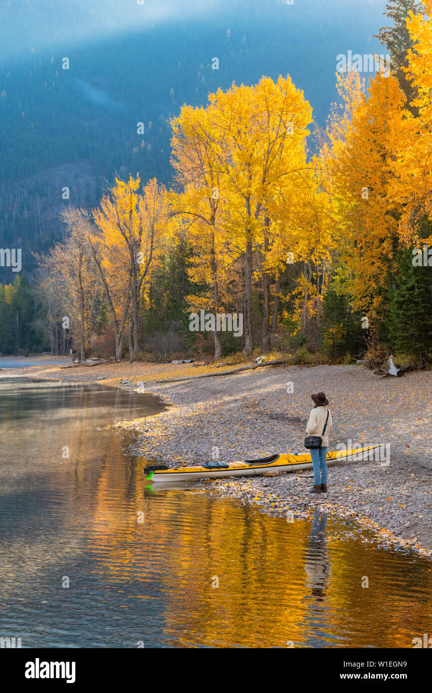 Woman on the shore of Lake McDonald, Glacier National Park, Montana, United States of America, North America Stock Photo