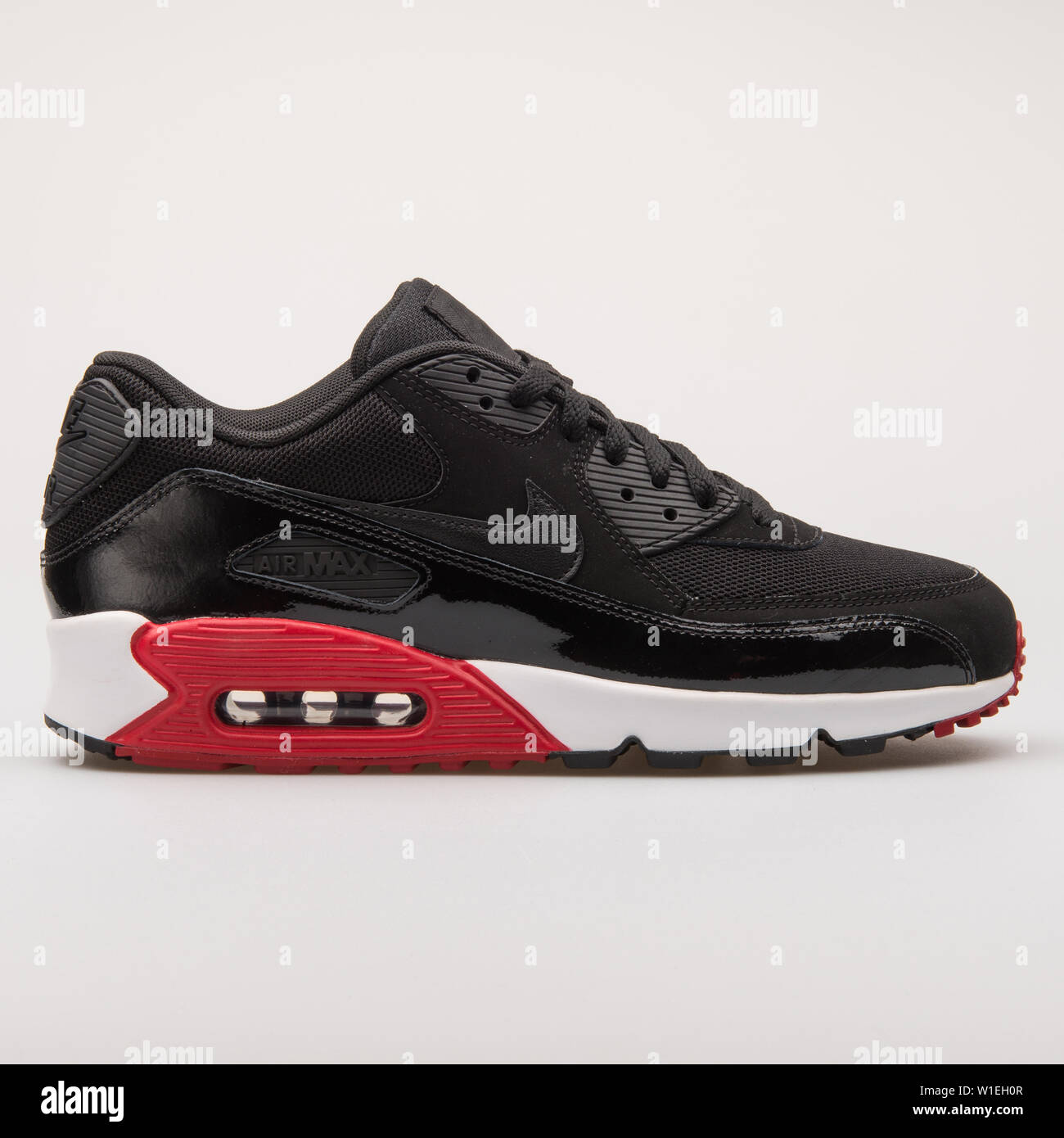 VIENNA, AUSTRIA - AUGUST 23, 2017: Nike Air Max 90 Essential black and red  sneaker on white background Stock Photo - Alamy