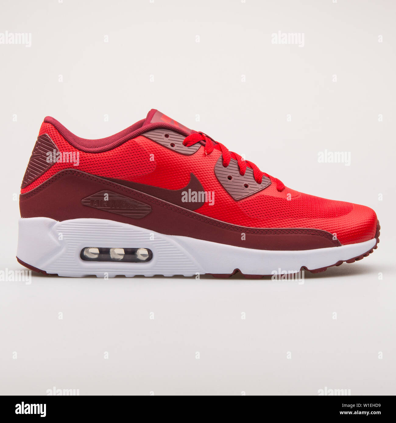 VIENNA, AUSTRIA - AUGUST 23, 2017: Nike Air Max 90 Ultra 2.0 Essential red  sneaker on white background Stock Photo - Alamy