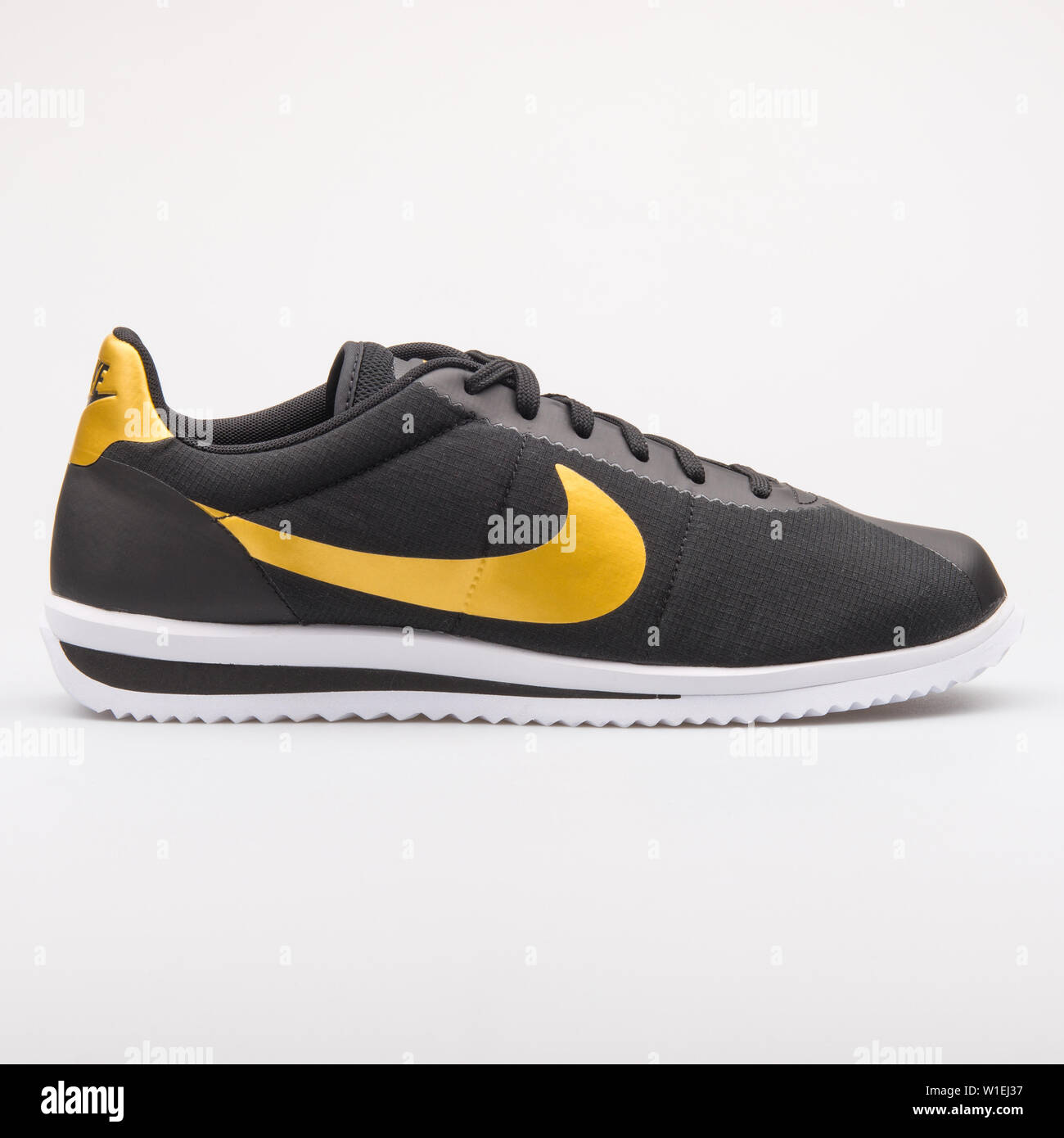 VIENNA, AUSTRIA - AUGUST 23, 2017: Nike Cortez Ultra QS black and gold  sneaker on white background Stock Photo - Alamy