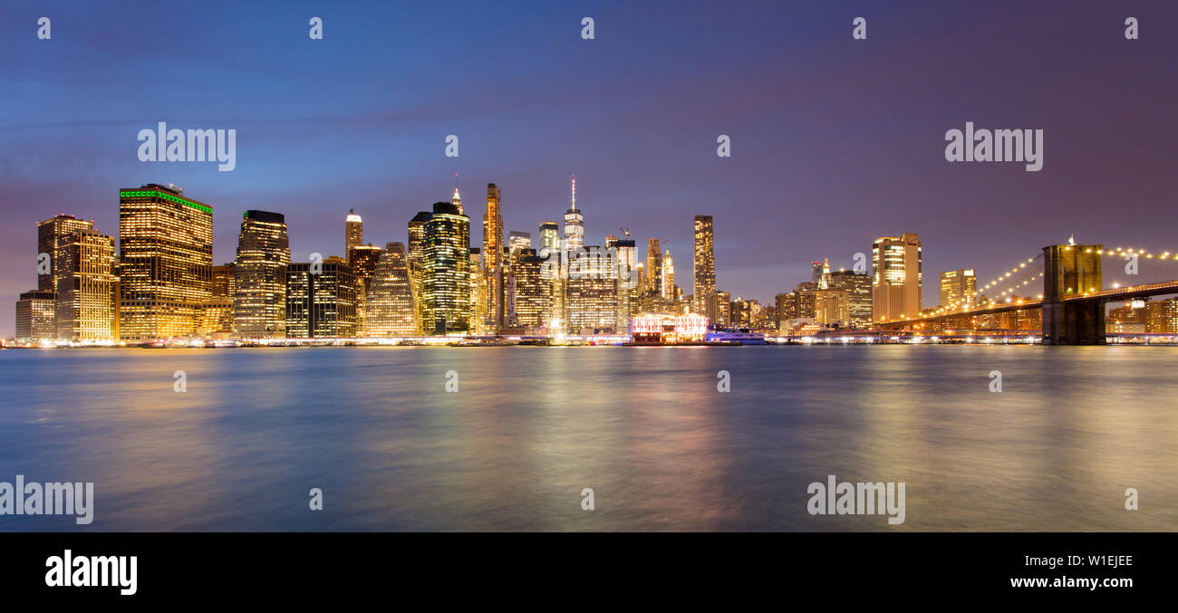 Lower Manhattan skyline and Brooklyn Bridge at dawn, New York City, New