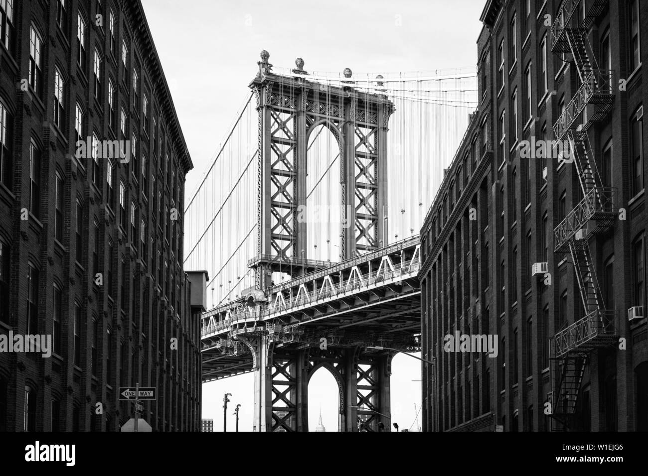 Manhattan Bridge with the Empire State Building through the Arches, New York City, New York, United States of America, North America Stock Photo