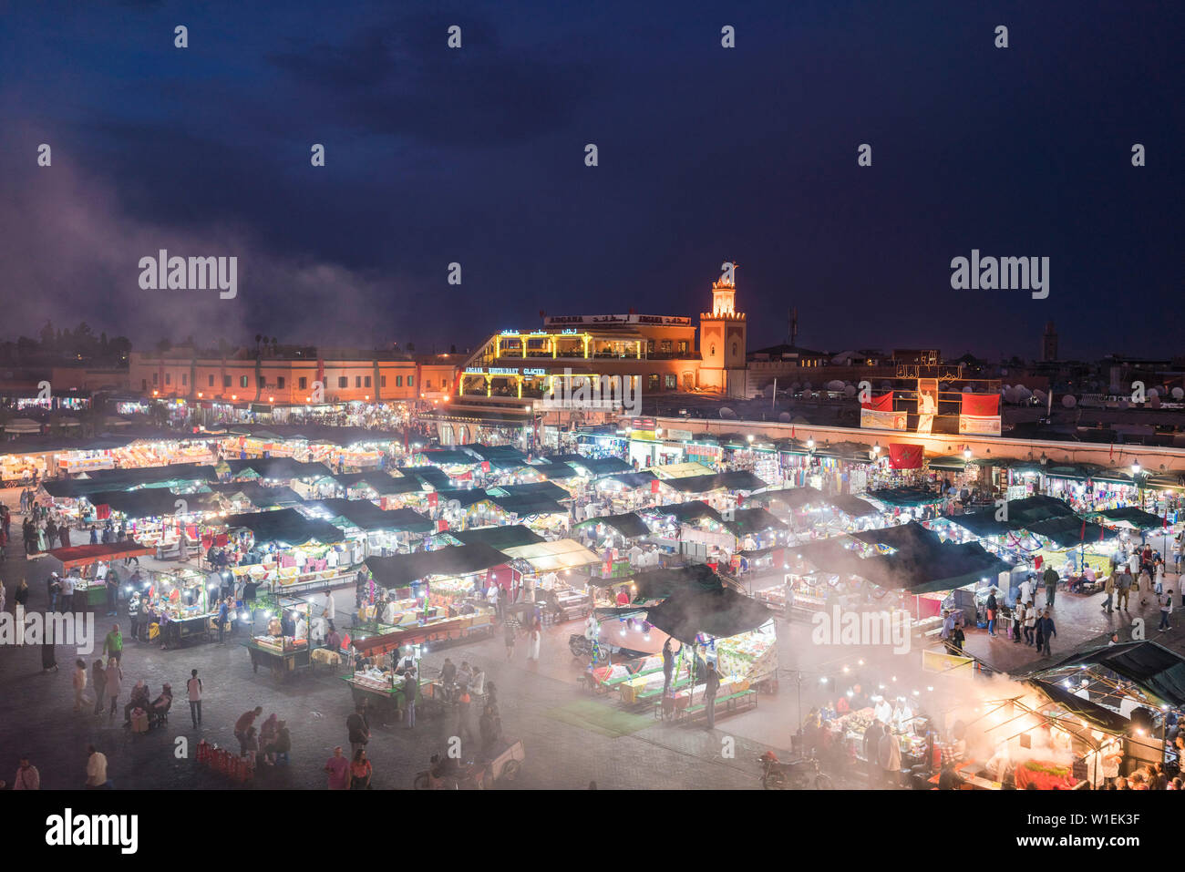 Jemaa el-Fnaa at sunset, bustling market square, UNESCO World Heritage Site, Marrakesh, Morocco, North Africa, Africa Stock Photo