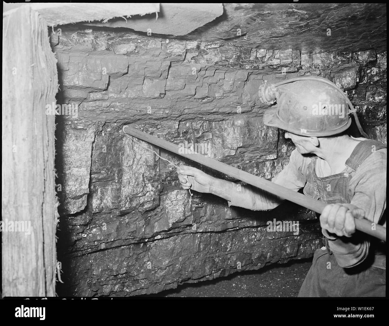 Tamping the powder charge preparatory to ignition inland steel company
