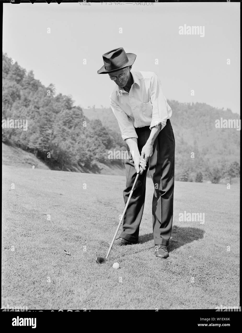 Harry Fain, coal loader, putting on one of the greens of the golf ...