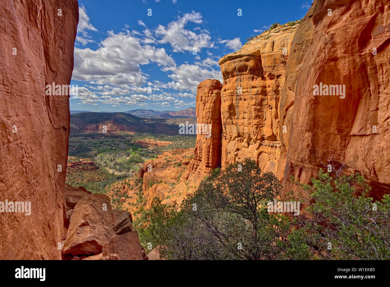 Northwest view of Sedona from within the saddle on Cathedral Rock, Sedona, Arizona, United States of America, North America Stock Photo