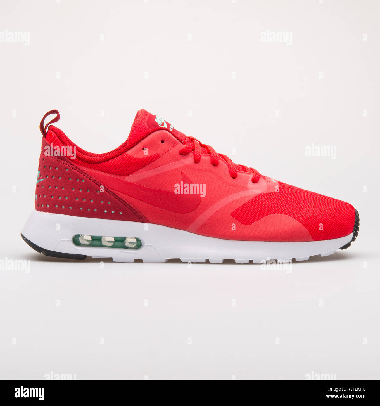 VIENNA, AUSTRIA - AUGUST 28, 2017: Nike Air Max Tavas red sneaker on white  background Stock Photo - Alamy