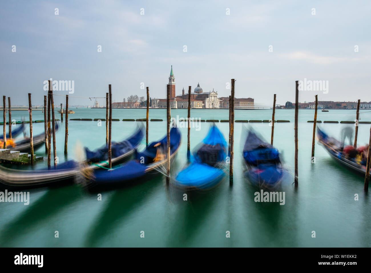 Gondolas moored in Piazza San Marco with San Giorgio Maggiore church in the background, Venice, UNESCO World Heritage Site, Veneto, Italy, Europe Stock Photo