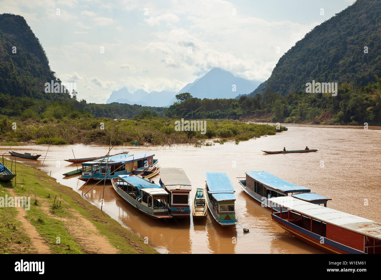 Boats on the Nam Ou River at Muang Ngoi Neua, Muang Ngoi District, Luang Prabang Province, Northern Laos, Laos, Indochina, Southeast Asia, Asia Stock Photo