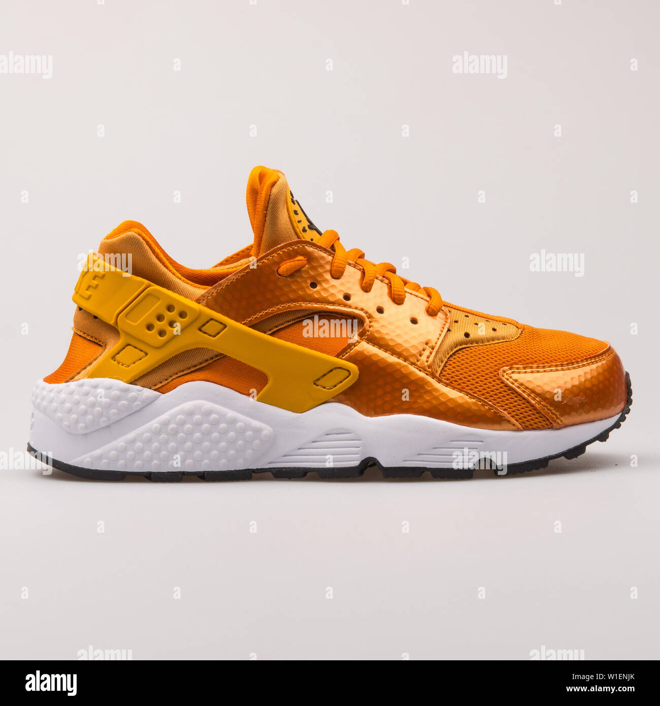 Nike Air Huarache Run gold sneaker on 