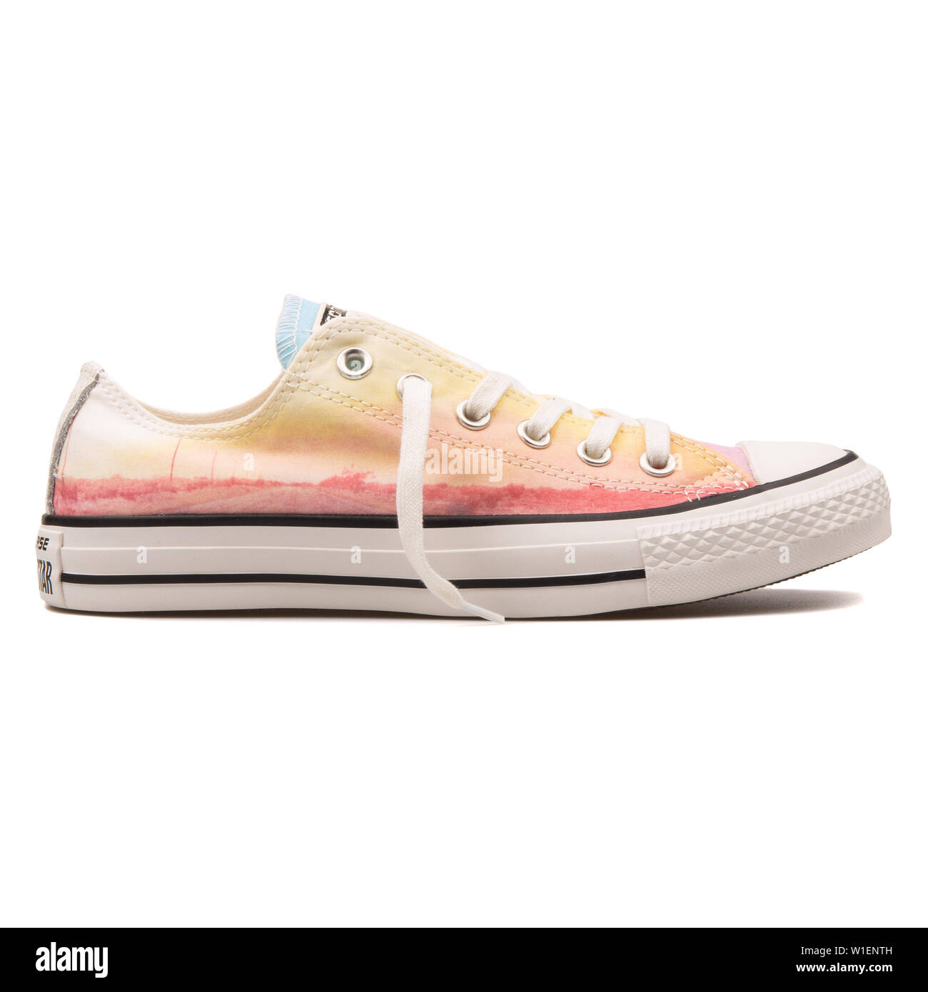 Converse shoe on yellow hi-res stock photography and images - Alamy