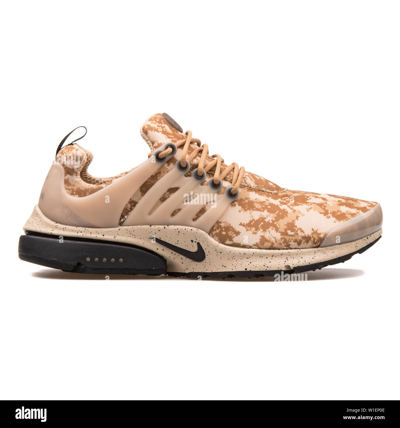 VIENNA, AUSTRIA - AUGUST 10, 2017: Nike Air Presto GPX golden beige and  black sneaker on white background Stock Photo - Alamy