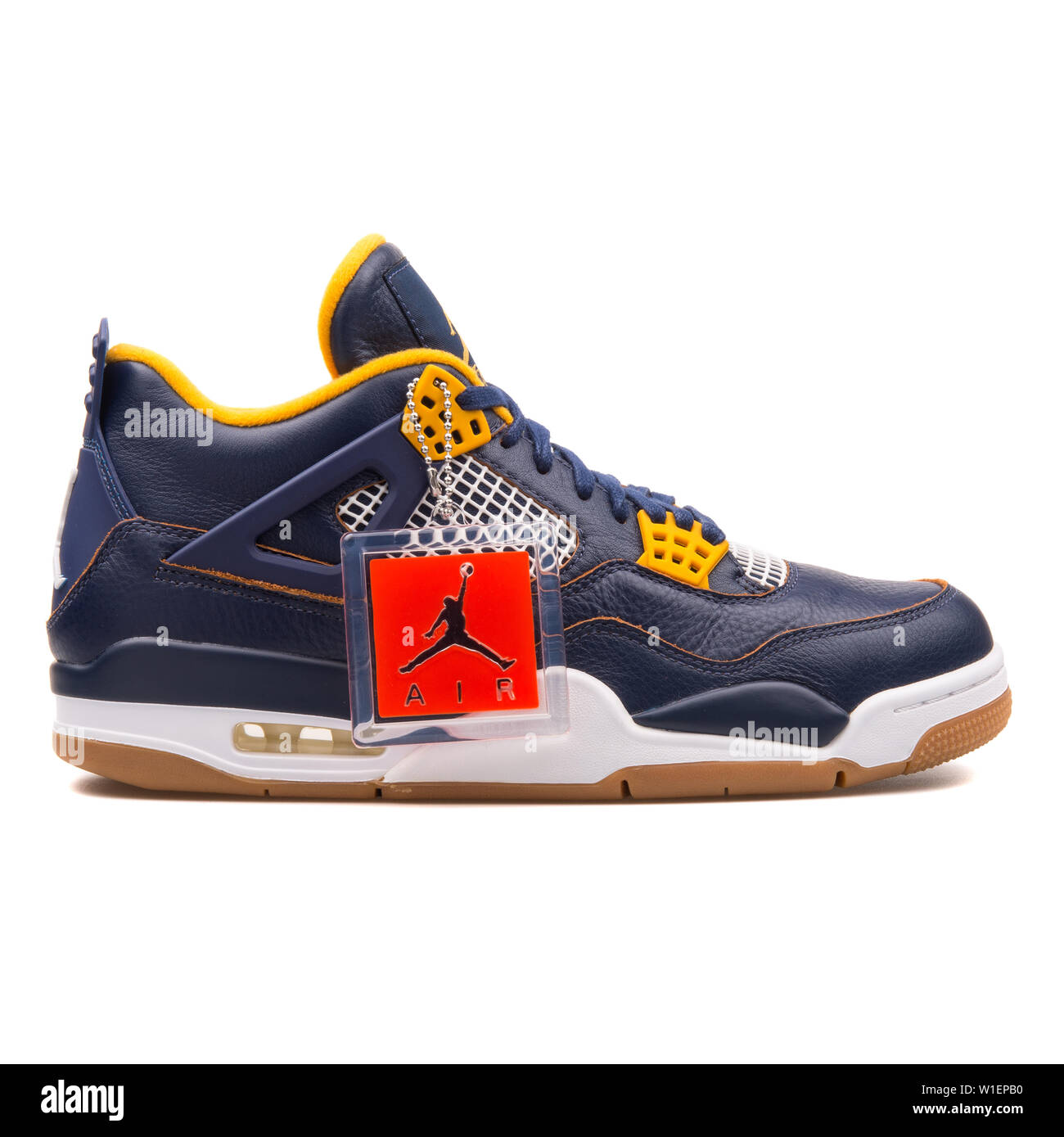 VIENNA, AUSTRIA - AUGUST 10, 2017: Nike Air Jordan 4 Retro navy blue and  gold sneaker on white background Stock Photo - Alamy