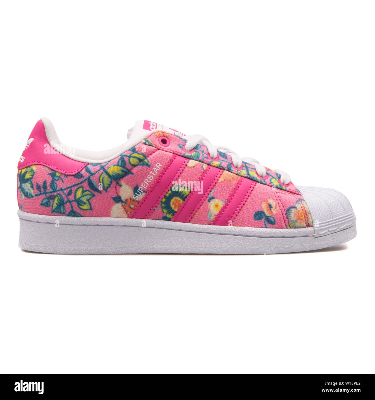 VIENNA, AUSTRIA - AUGUST 10, 2017: Adidas Superstar pink and floral print  sneaker on white background Stock Photo - Alamy
