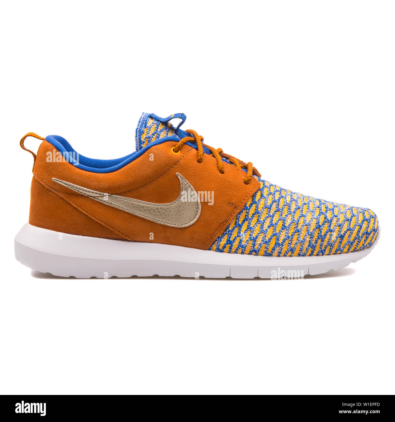 VIENNA, AUSTRIA - AUGUST 10, 2017: Nike Roshe One NM Flyknit Premium brown,  gold and blue sneaker on white background Stock Photo - Alamy