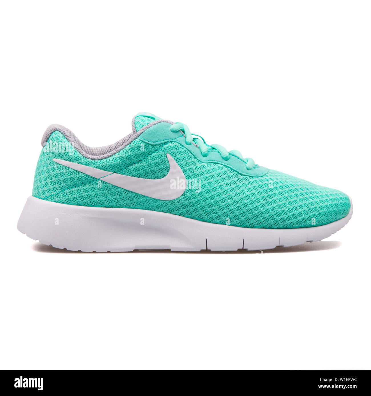 VIENNA, AUSTRIA - AUGUST 10, 2017: Nike Tanjun hyper turquoise sneaker on  white background Stock Photo - Alamy