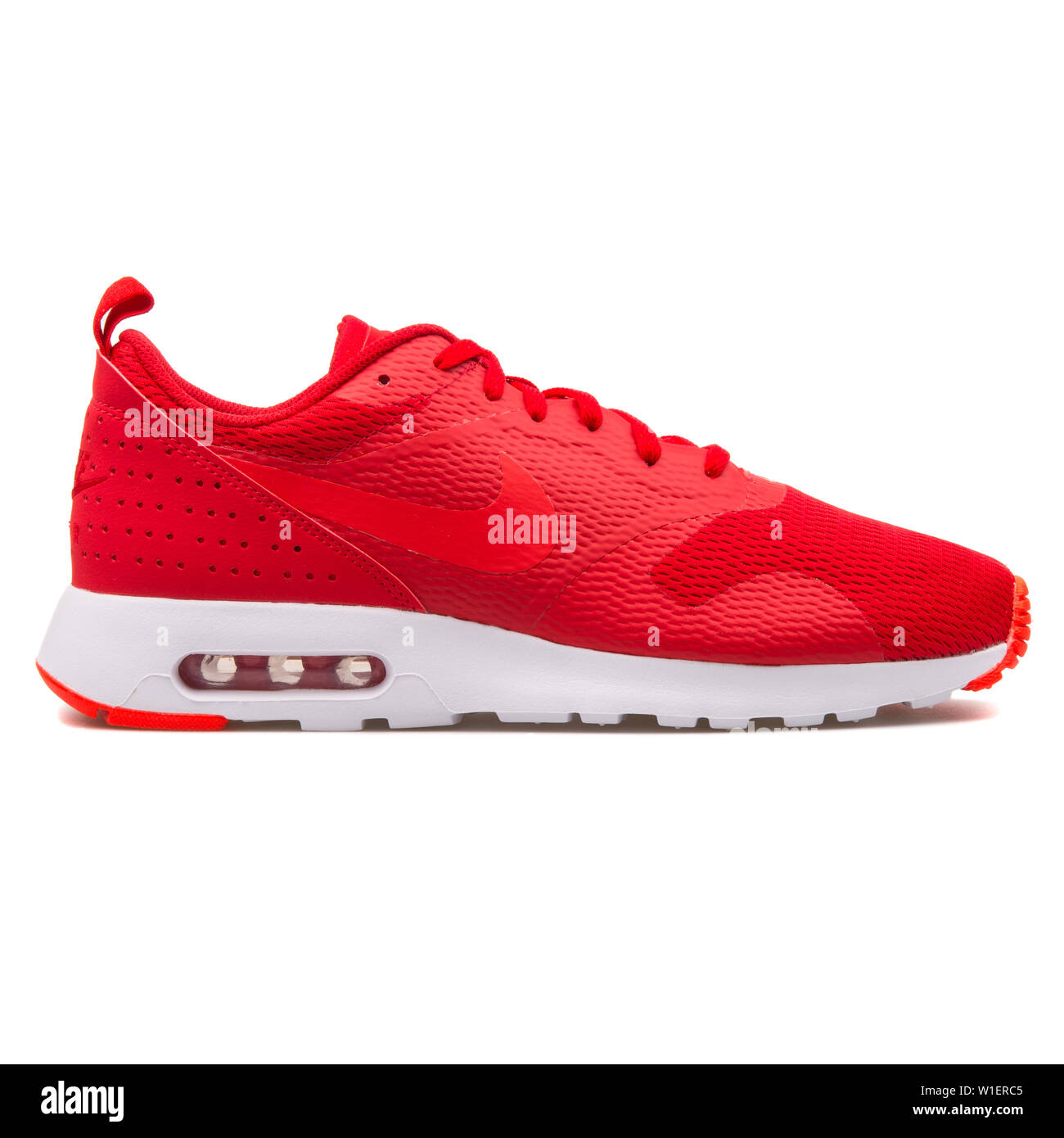 VIENNA, AUSTRIA - AUGUST 10, 2017: Nike Air Max Tavas red sneaker on white  background Stock Photo - Alamy