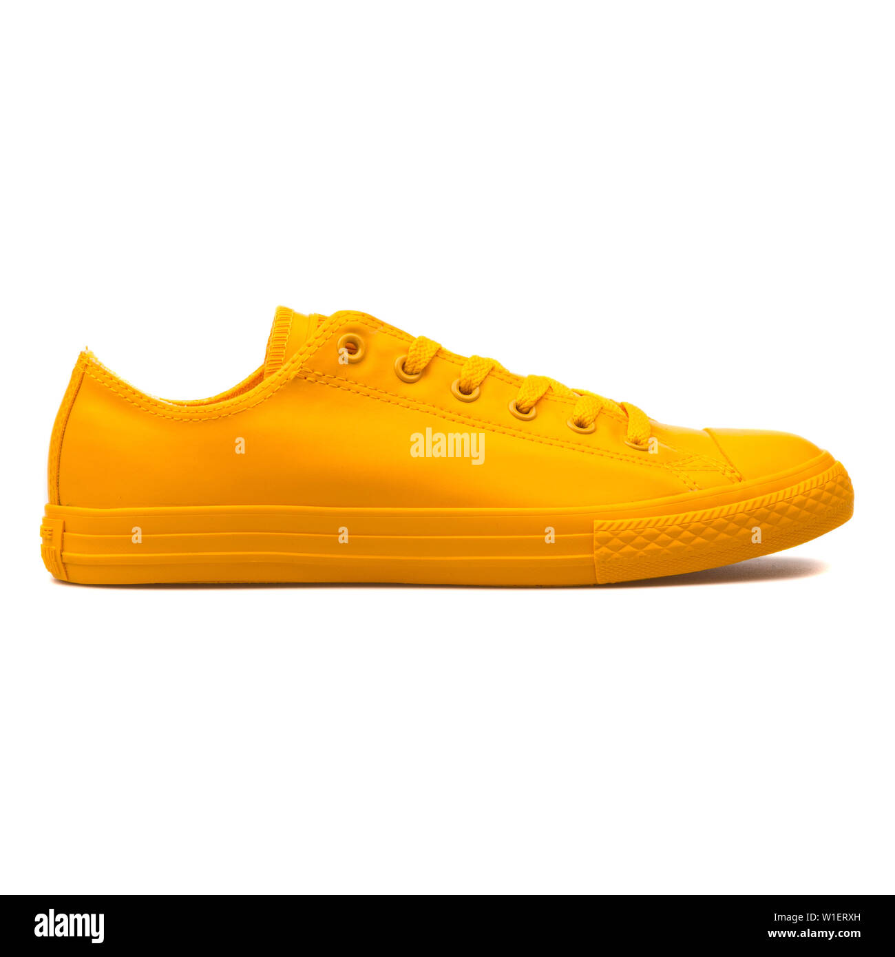 VIENNA, AUSTRIA - AUGUST 10, 2017: Converse Chuck Taylor All Star Rubber OX  Honey yellow sneaker on white background Stock Photo - Alamy