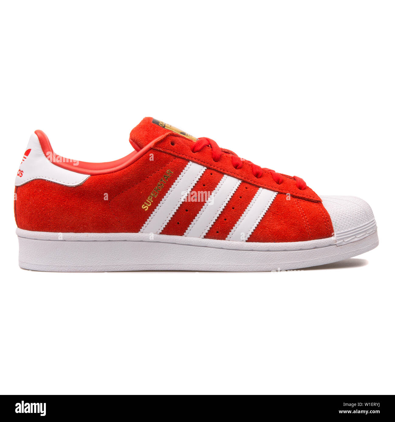 VIENNA, AUSTRIA - AUGUST 10, 2017: Adidas Superstar Suede red and white  sneaker on white background Stock Photo - Alamy