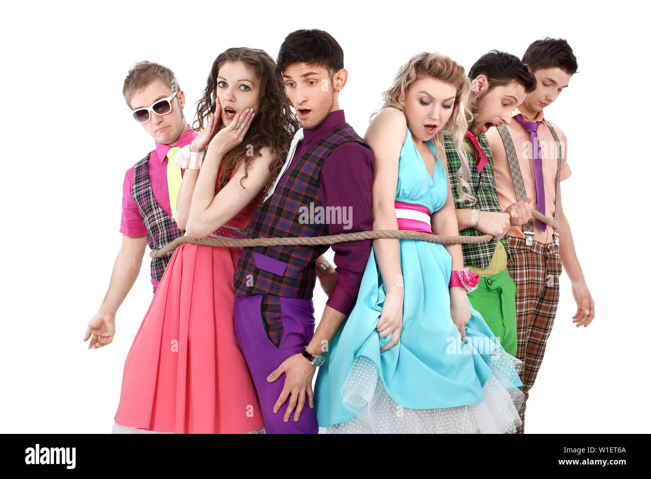 group of young people in bright clothes, tied with a rope.isolated on white background Stock Photo